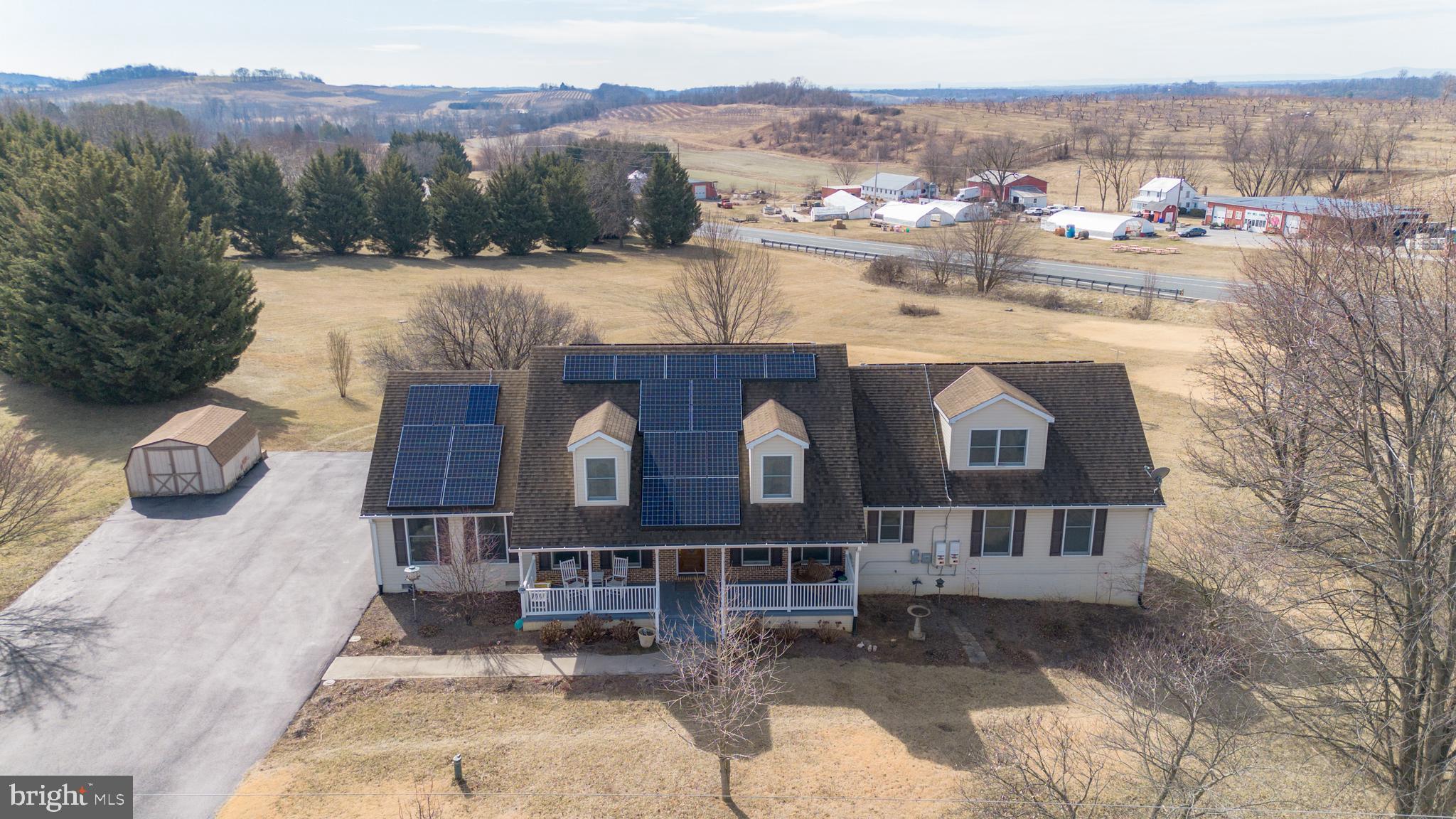 13810 Franks Run Road Smithsburg, MD 21783 - Photo 66 of 72 a front view of a house with a yard and mountain view in back