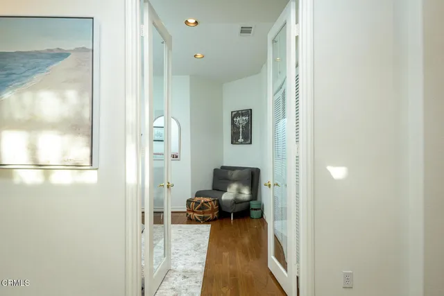 a living room with furniture and a gate