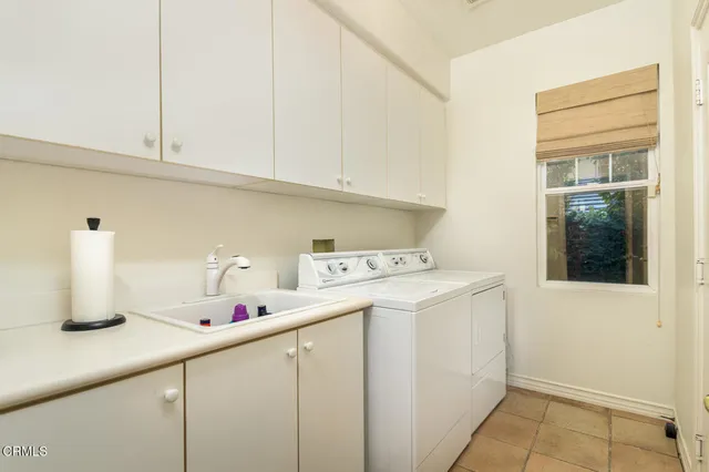 a bedroom with a bed chair and a window