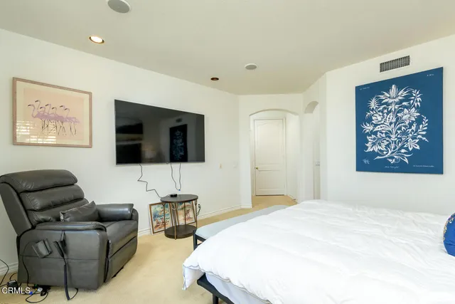 a bedroom with a bed and a table in it