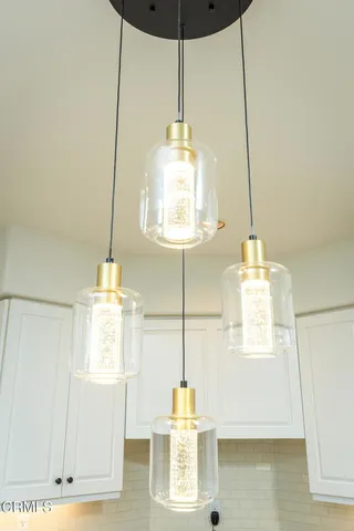 a view of a house with backyard and trees