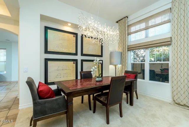 a dining room with furniture and window