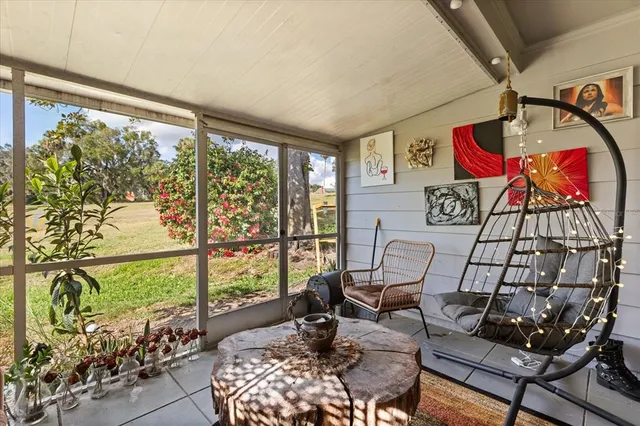 a living room with furniture and outdoor view