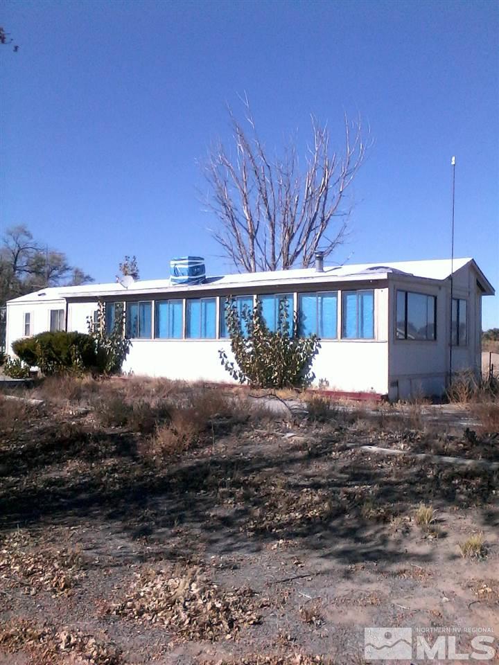 7300 Reno Highway Fallon, NV 89406 - Photo 1 of 2 a view of a big house with a yard
