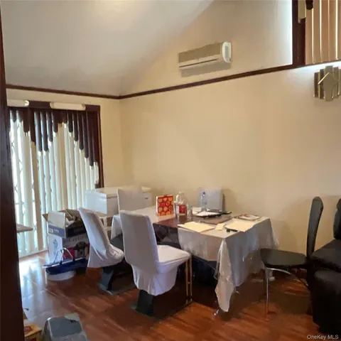 a view of a dining room with furniture and a window