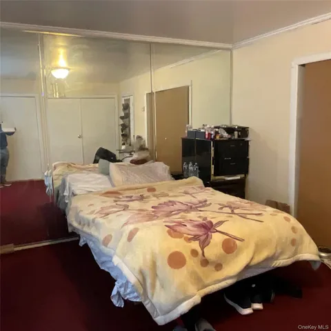 a bedroom with a bed and a table in it