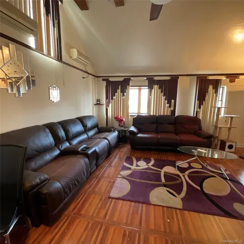 a living room with furniture and a lamp