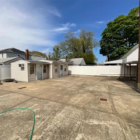a view of house with outdoor space and sitting area
