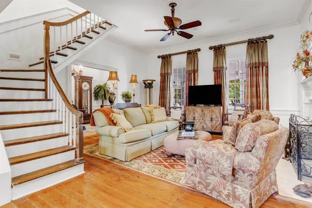 a living room with furniture fireplace and a chandelier