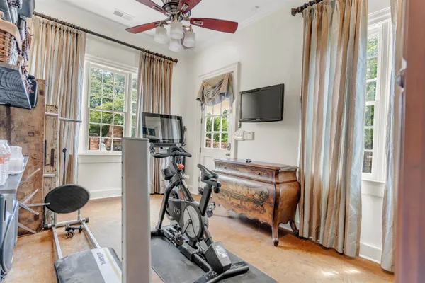 a living room with furniture a window and a chandelier