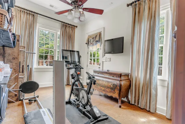 a living room with furniture a window and a chandelier