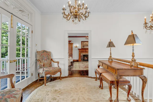 a spacious bedroom with a bed and a fireplace