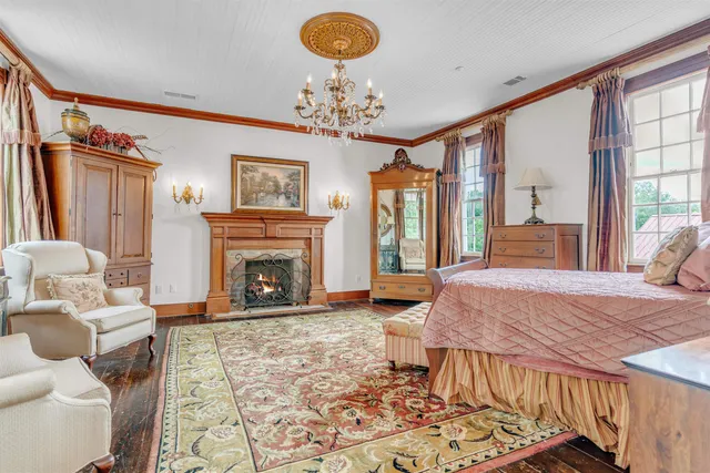 a spacious bathroom with a tub a mirror and shower