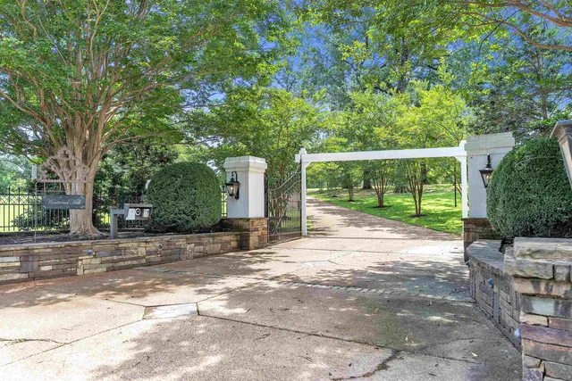 a living room with furniture a rug and a chandelier