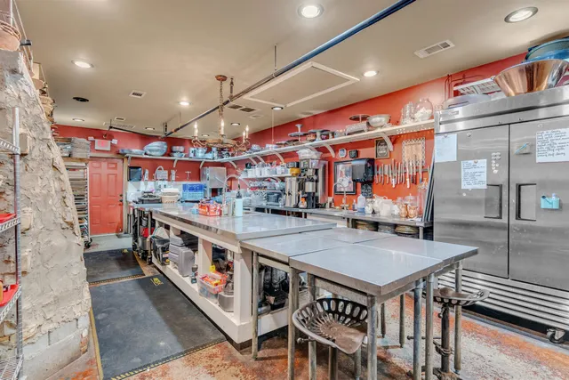 a view of a garden with a building in the background