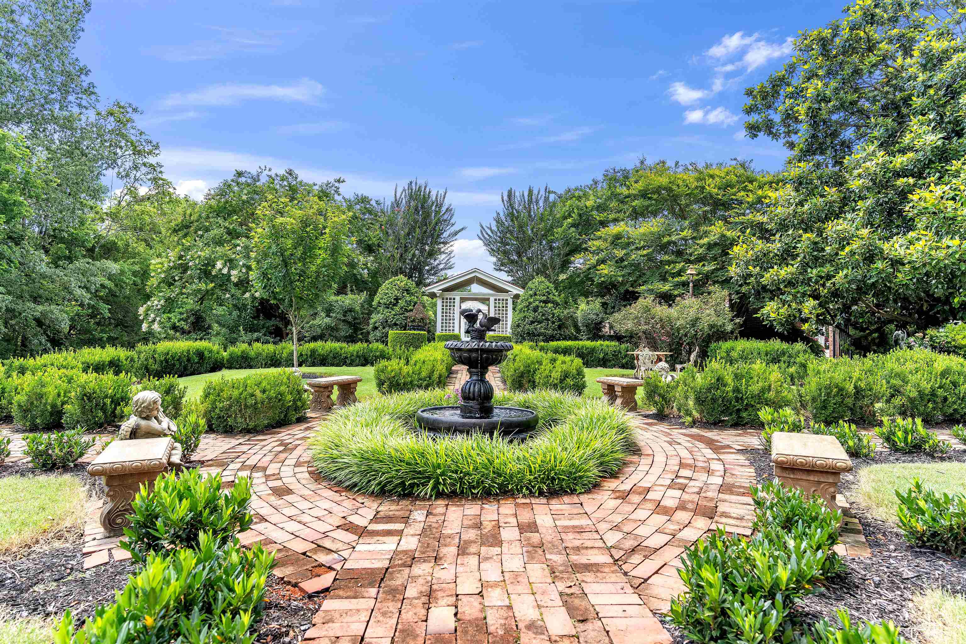 2665 Raleigh Lagrange Drive Piperton, TN 38066 - Photo 37 of 40 a view of a garden with a fountain