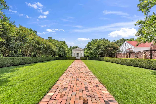 an aerial view of a house with outdoor space and street view
