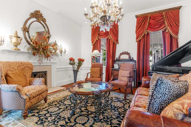 a view of a livingroom with furniture and book shelf