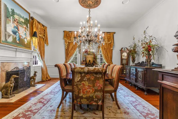 a view of a dining room with furniture and windows