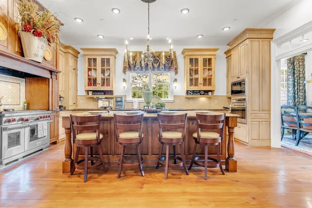 a living room with furniture ceiling fan and a flat screen tv