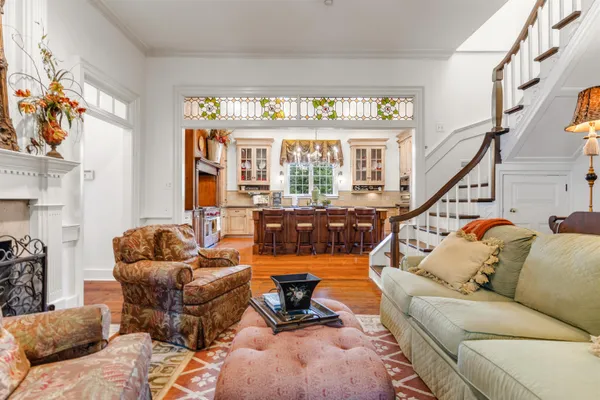 a bedroom with furniture and a chandelier