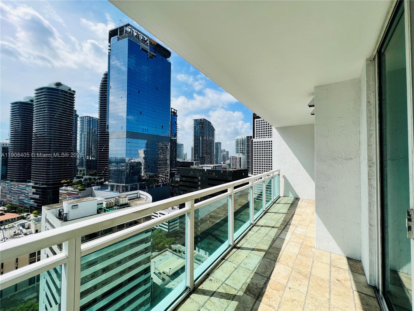 951 Brickell Avenue, Unit 2407 Miami, FL 33131 - Photo 17 of 19 a view of balcony with two chairs and a table