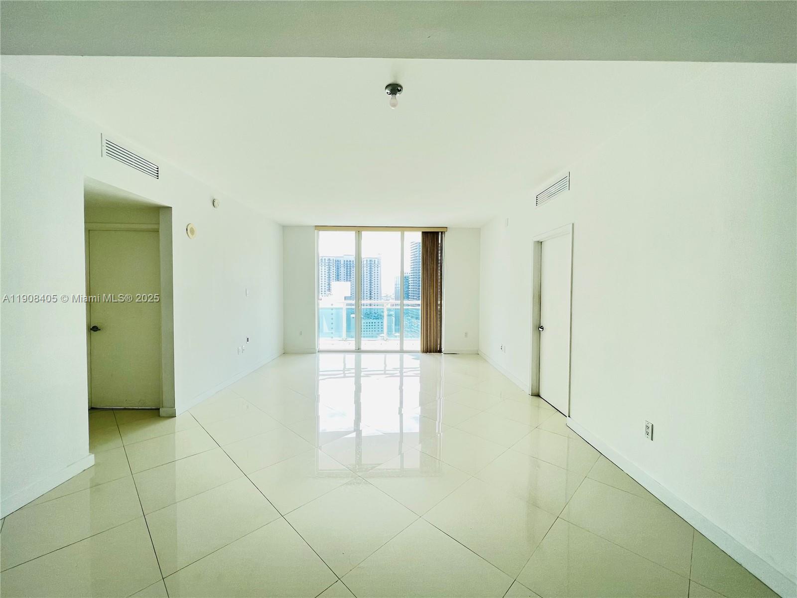 951 Brickell Avenue, Unit 2407 Miami, FL 33131 - Photo 3 of 19 a big room with natural light