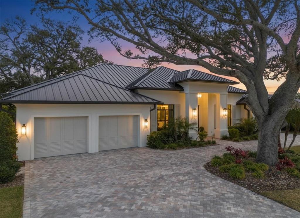 634 Poinsettia Road Belleair, FL 33756 - Photo 1 of 1 a front view of house with yard and trees