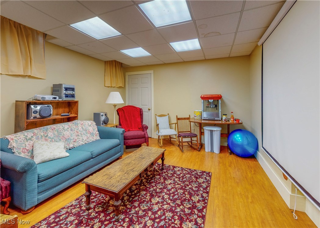 5696 Steubenville Road Southeast Amsterdam, OH 43903 - Photo 26 of 50 Living room with hardwood / wood-style flooring and a paneled ceiling