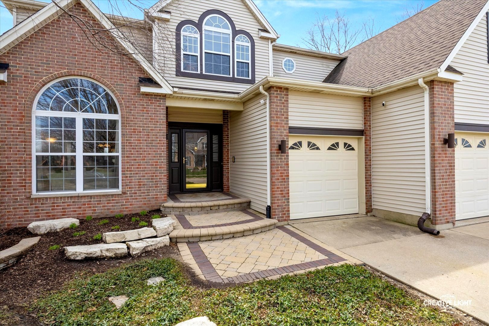 1524 West Mooseheart Road North Aurora, IL 60542 - Photo 2 of 32 a front view of a house with a yard