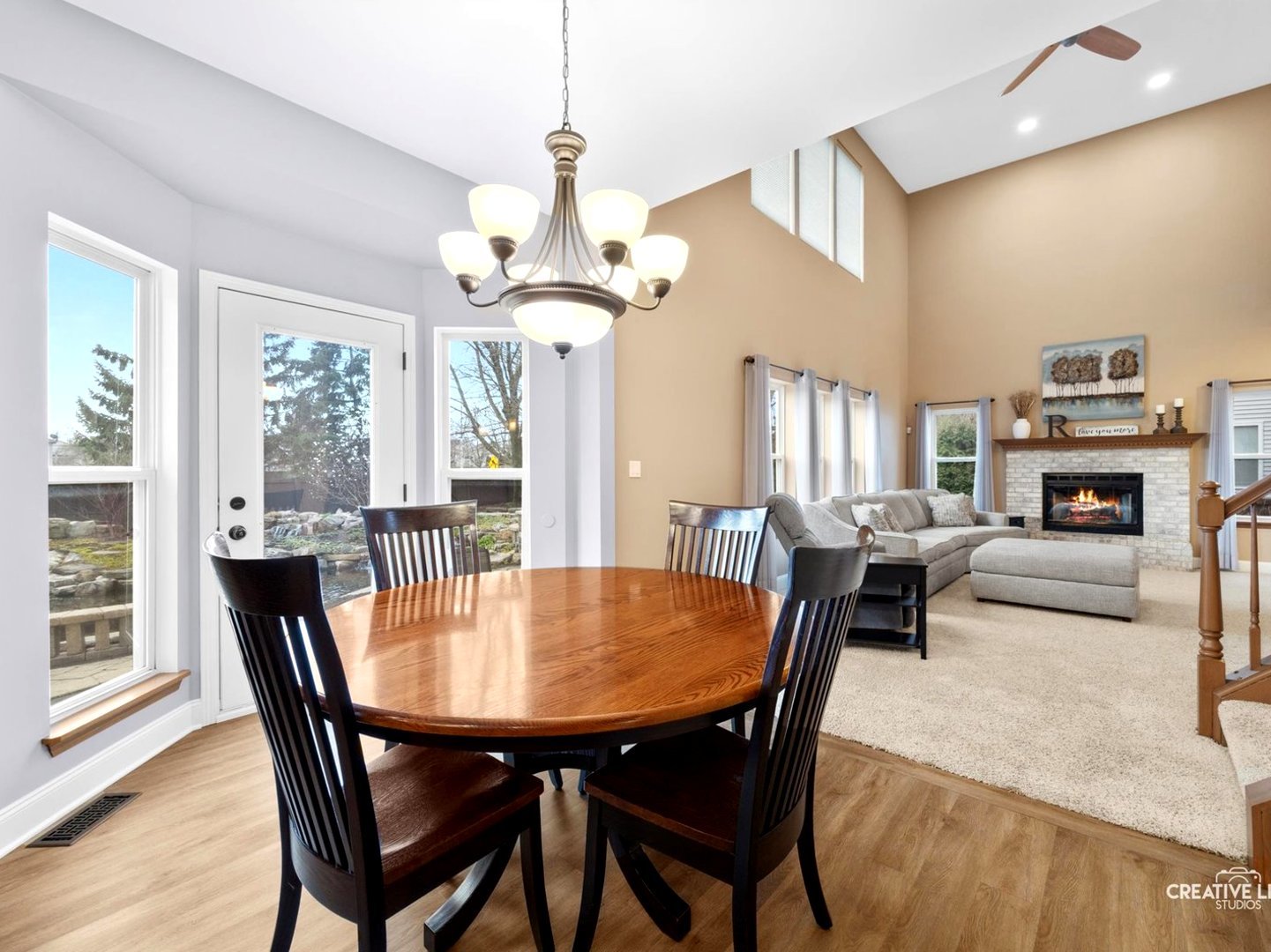 1524 West Mooseheart Road North Aurora, IL 60542 - Photo 7 of 32 a view of a dining room with furniture window and wooden floor