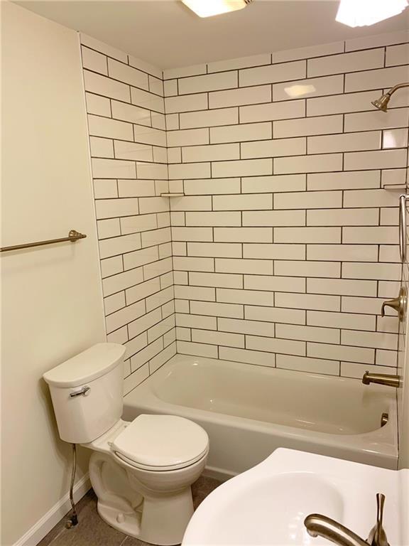 5144 Butler Street Pittsburgh, PA 15201 - Photo 14 of 20 a bathroom with a toilet and a shower