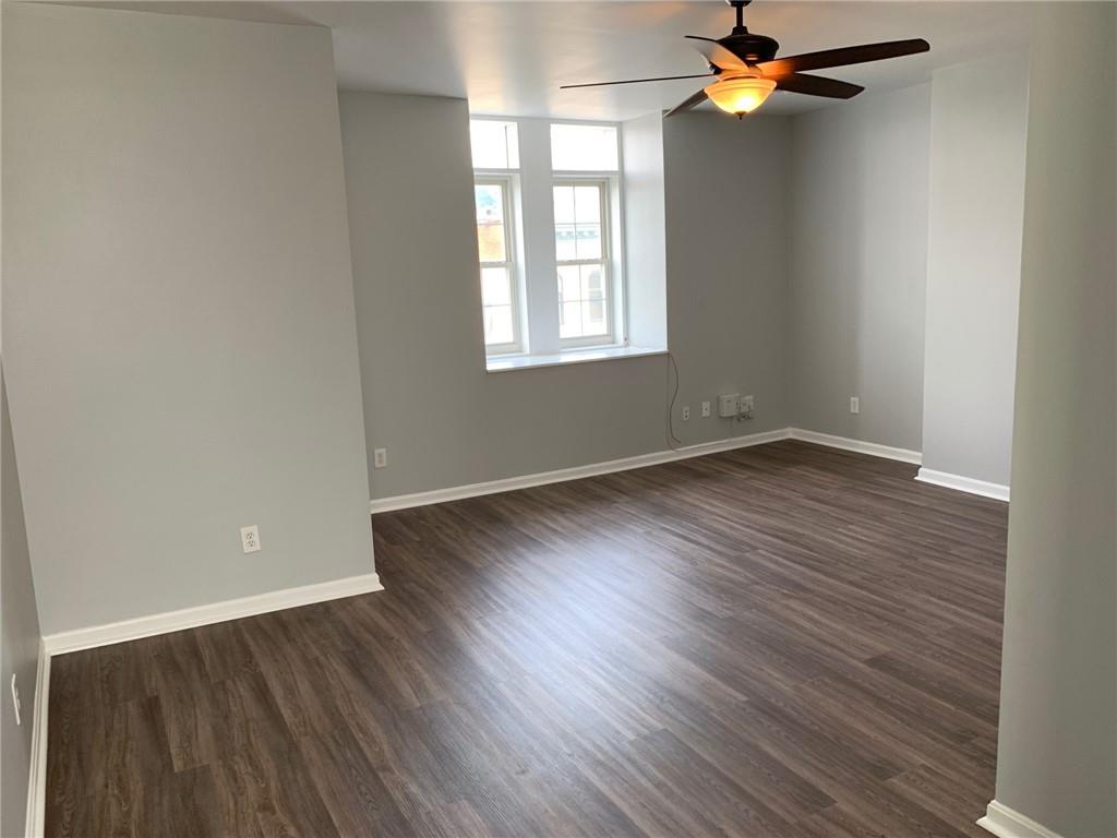 5144 Butler Street Pittsburgh, PA 15201 - Photo 18 of 20 wooden floor in an empty room with a window