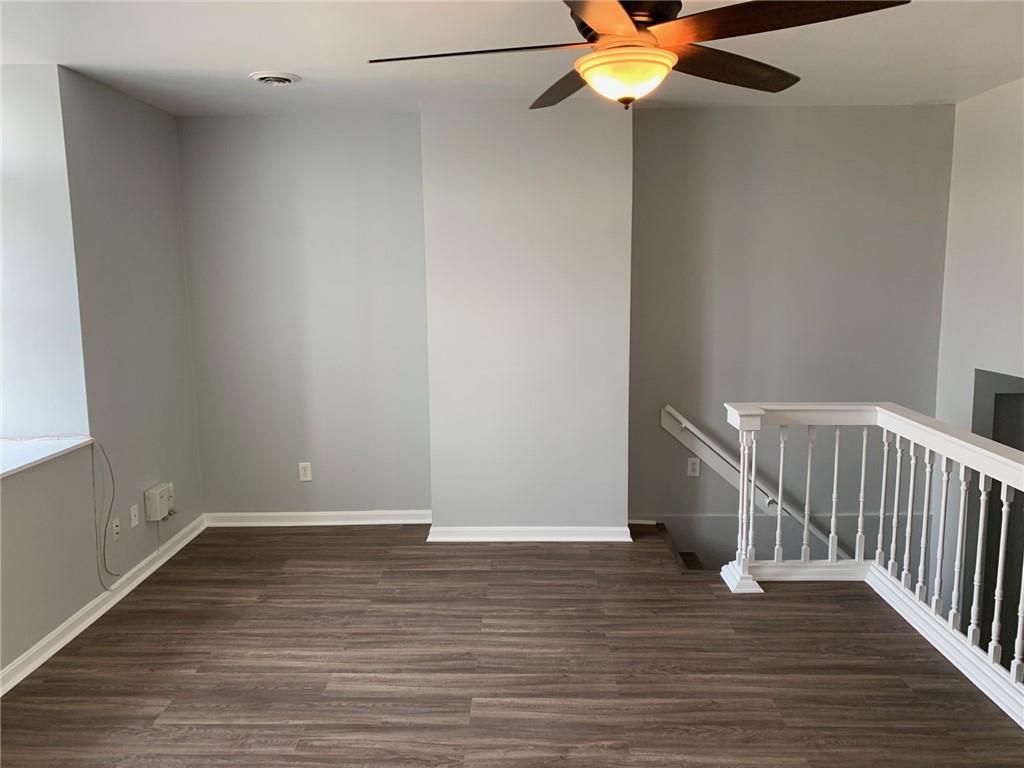 5144 Butler Street Pittsburgh, PA 15201 - Photo 19 of 20 a view of an empty room with wooden floor and fan