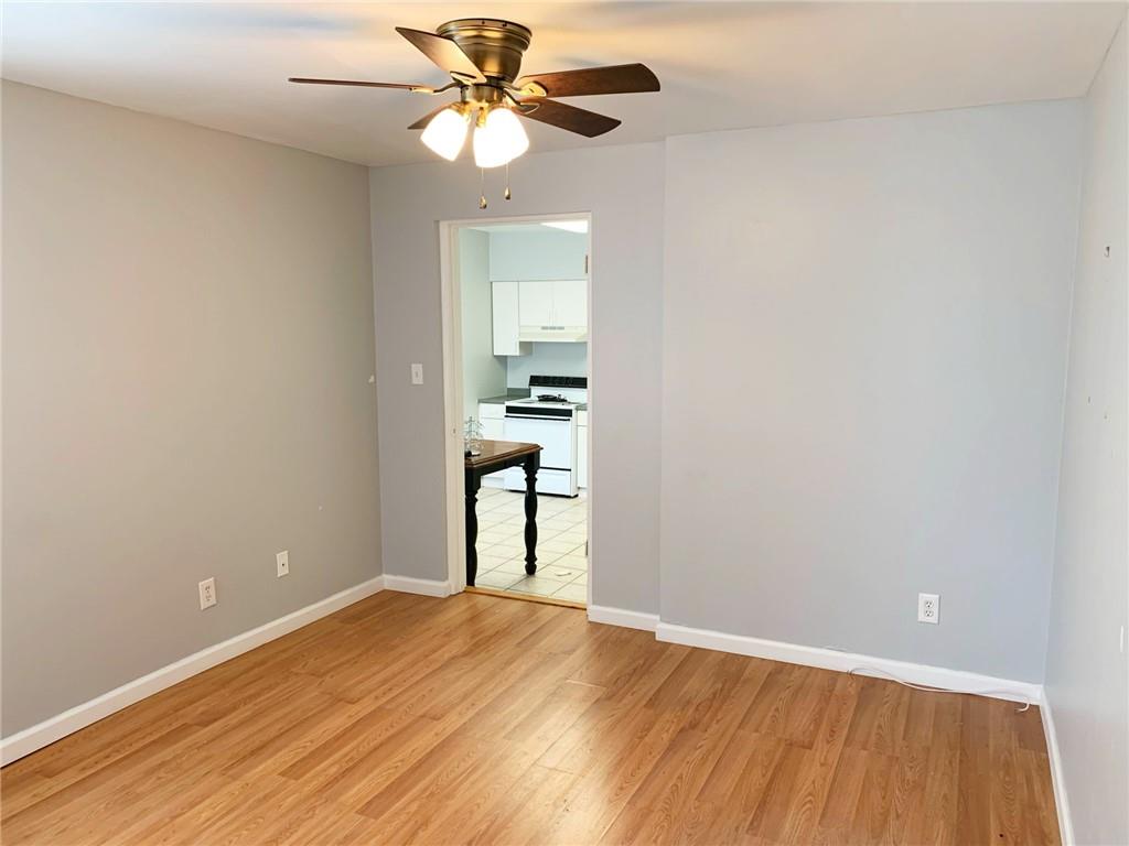 5144 Butler Street Pittsburgh, PA 15201 - Photo 7 of 20 wooden floor in an empty room with a window