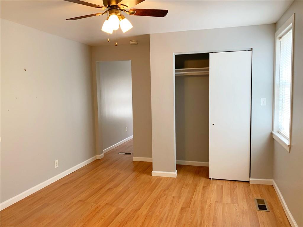 5144 Butler Street Pittsburgh, PA 15201 - Photo 8 of 20 a view of an empty room with wooden floor and a window