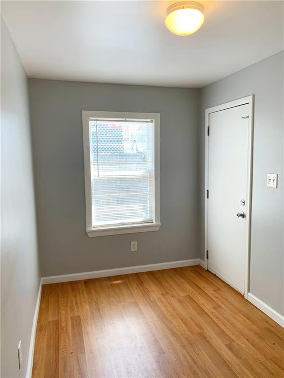 5144 Butler Street Pittsburgh, PA 15201 - Photo 9 of 20 an empty room with wooden floor and windows