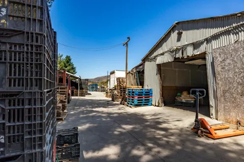 a view of a street with chairs