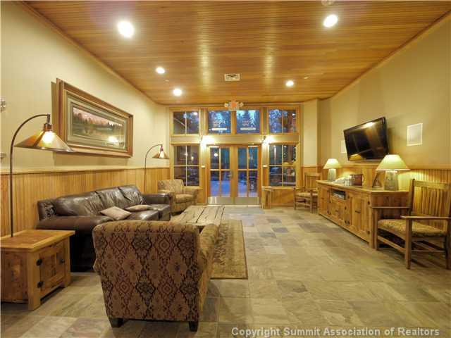 195 River Run Road, Unit 8005 Keystone, CO 80435 - Photo 9 of 12 a living room with furniture and a flat screen tv