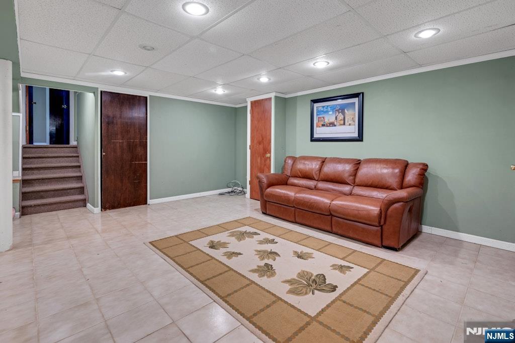 185 Ratzer Road Wayne, NJ 07470 - Photo 21 of 36 a living room with furniture and a rug
