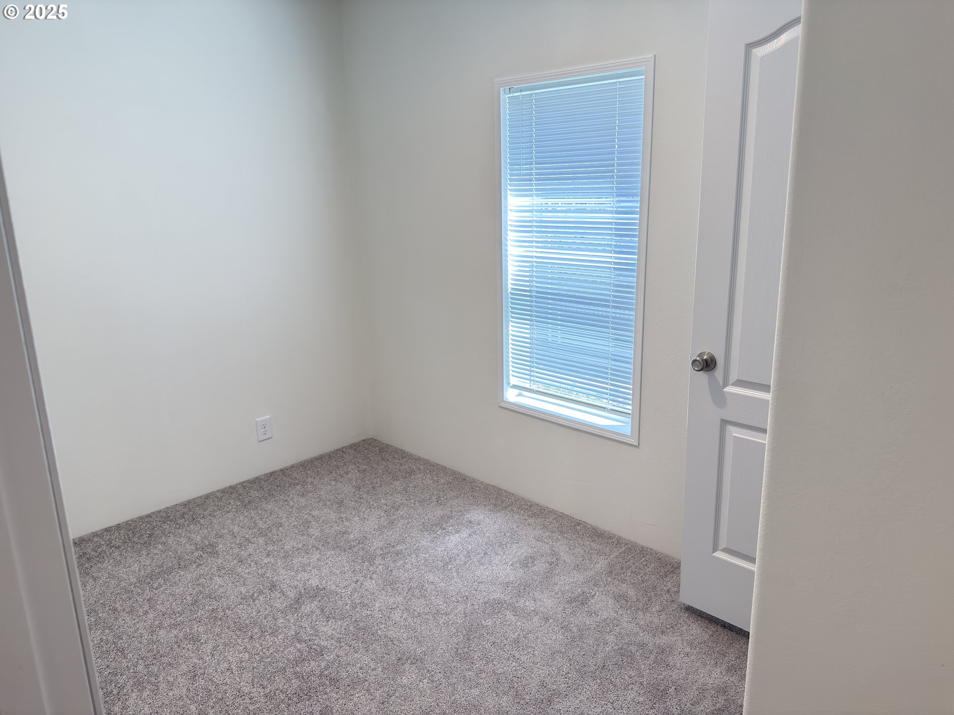 11316 Northeast 28th Street, Unit 3 Vancouver, WA 98682 - Photo 12 of 18 an empty room with windows and closet