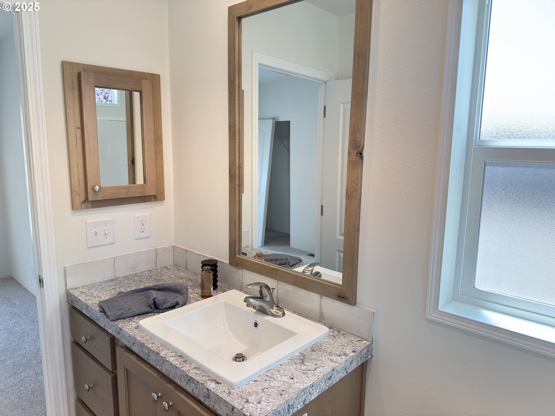 11316 Northeast 28th Street, Unit 3 Vancouver, WA 98682 - Photo 14 of 18 a bathroom with a sink and a mirror
