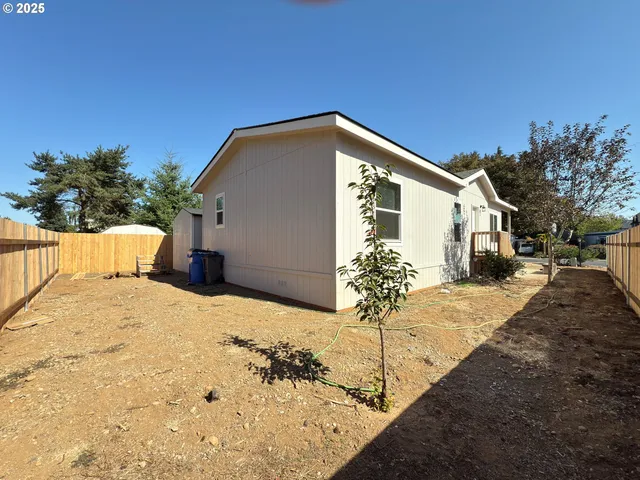 a view of a house with snow on the road
