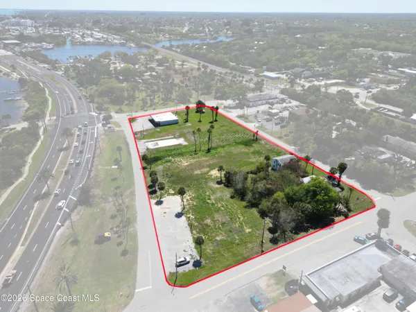 an aerial view of a residential houses with outdoor space