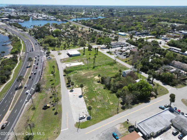 an aerial view of a residential houses with outdoor space