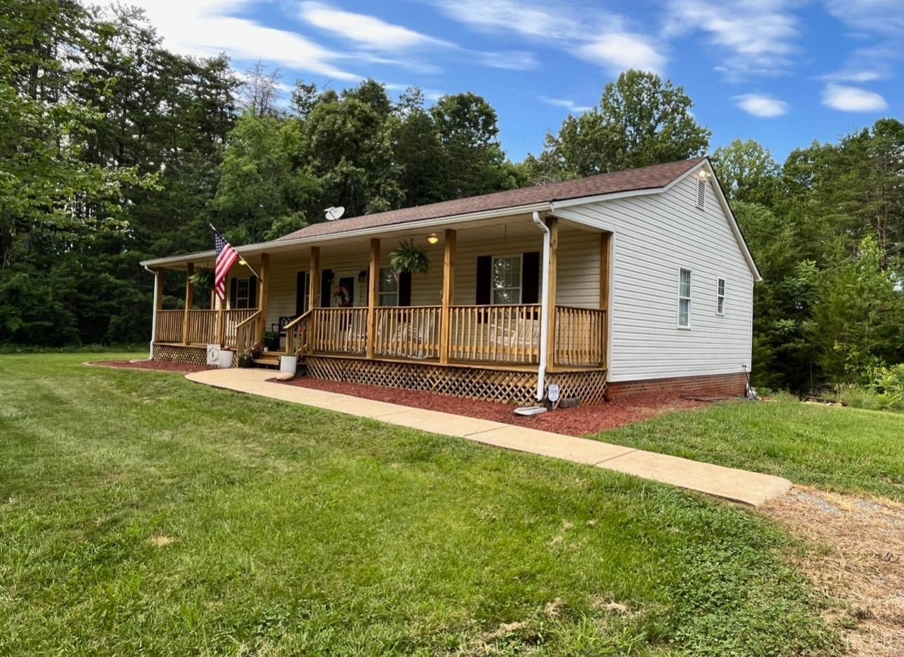 4898 Bethany Road Rustburg, VA 24588 - Photo 1 of 1 a view of a house with backyard and a tree