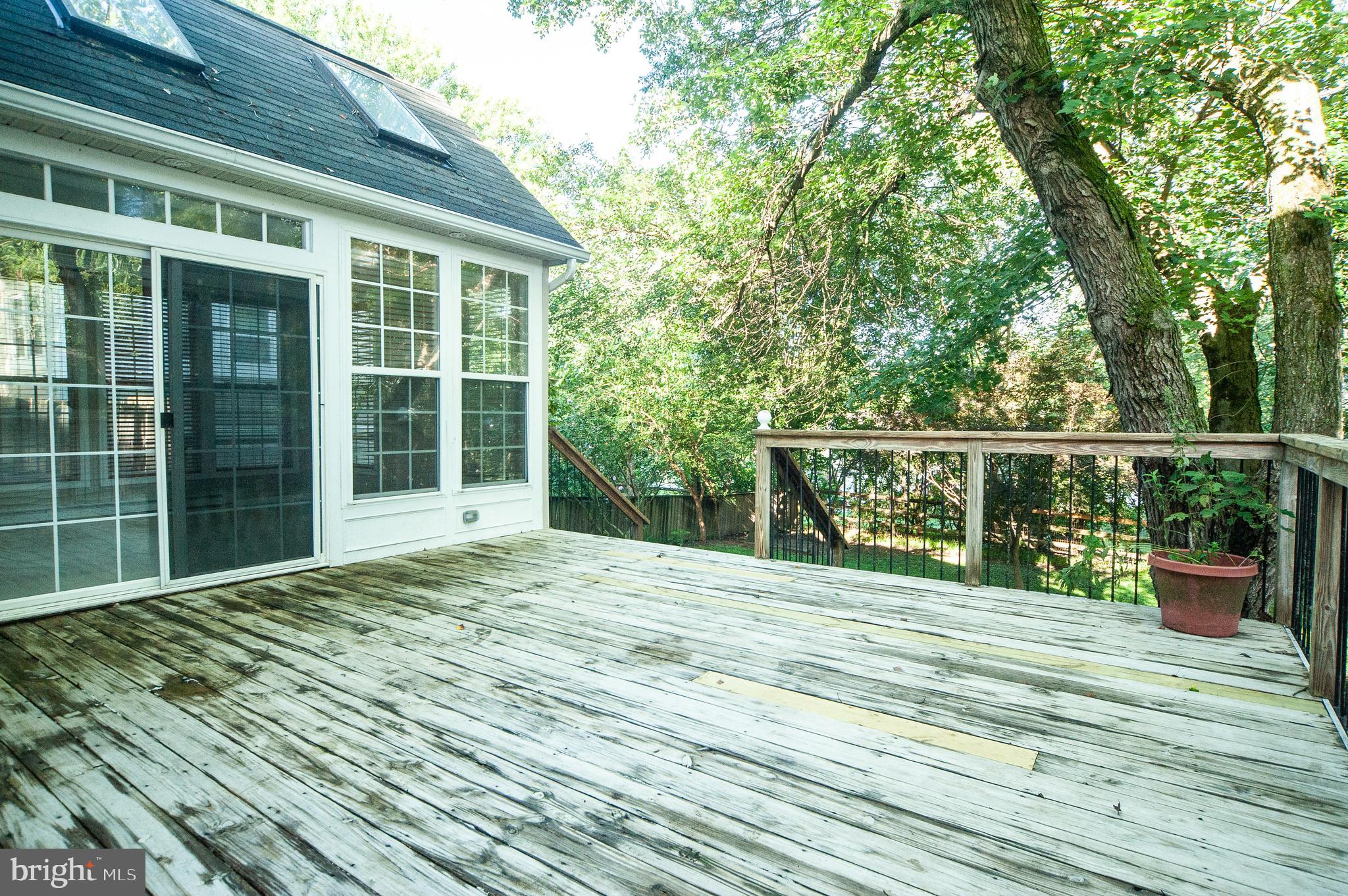 9624 Rocksparkle Row Columbia, MD 21045 - Photo 19 of 25 Deck with doors leading into sunroom.