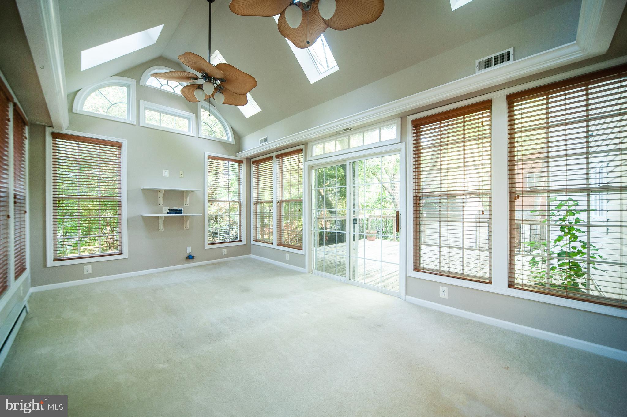 9624 Rocksparkle Row Columbia, MD 21045 - Photo 6 of 25 Bonus Sunroom with Doors leading out to Deck.