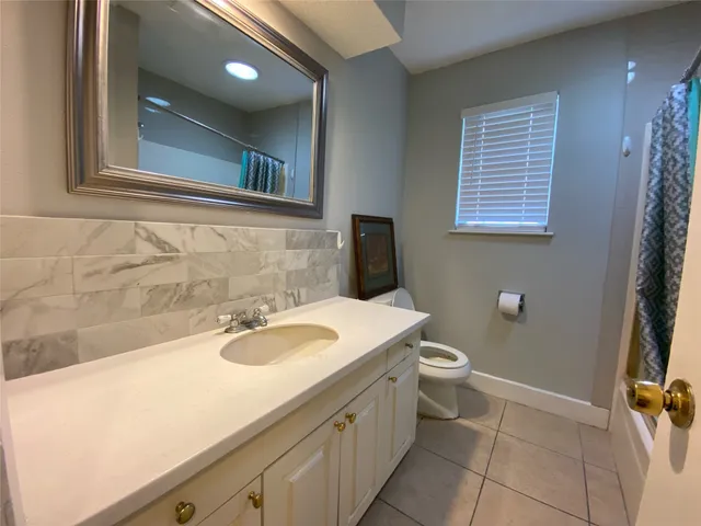 a bathroom with a sink a toilet and a bathtub