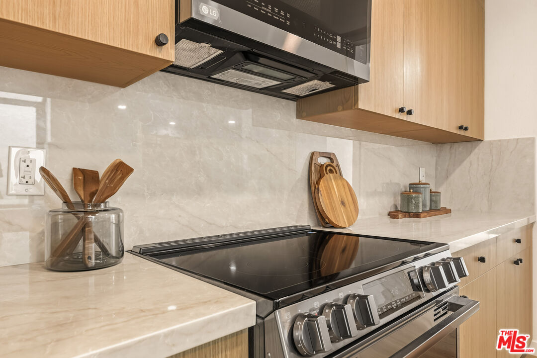 311 Bora Bora Way, Unit 3207 Marina del Rey, CA 90292 - Photo 15 of 54 a kitchen with a stove and a sink